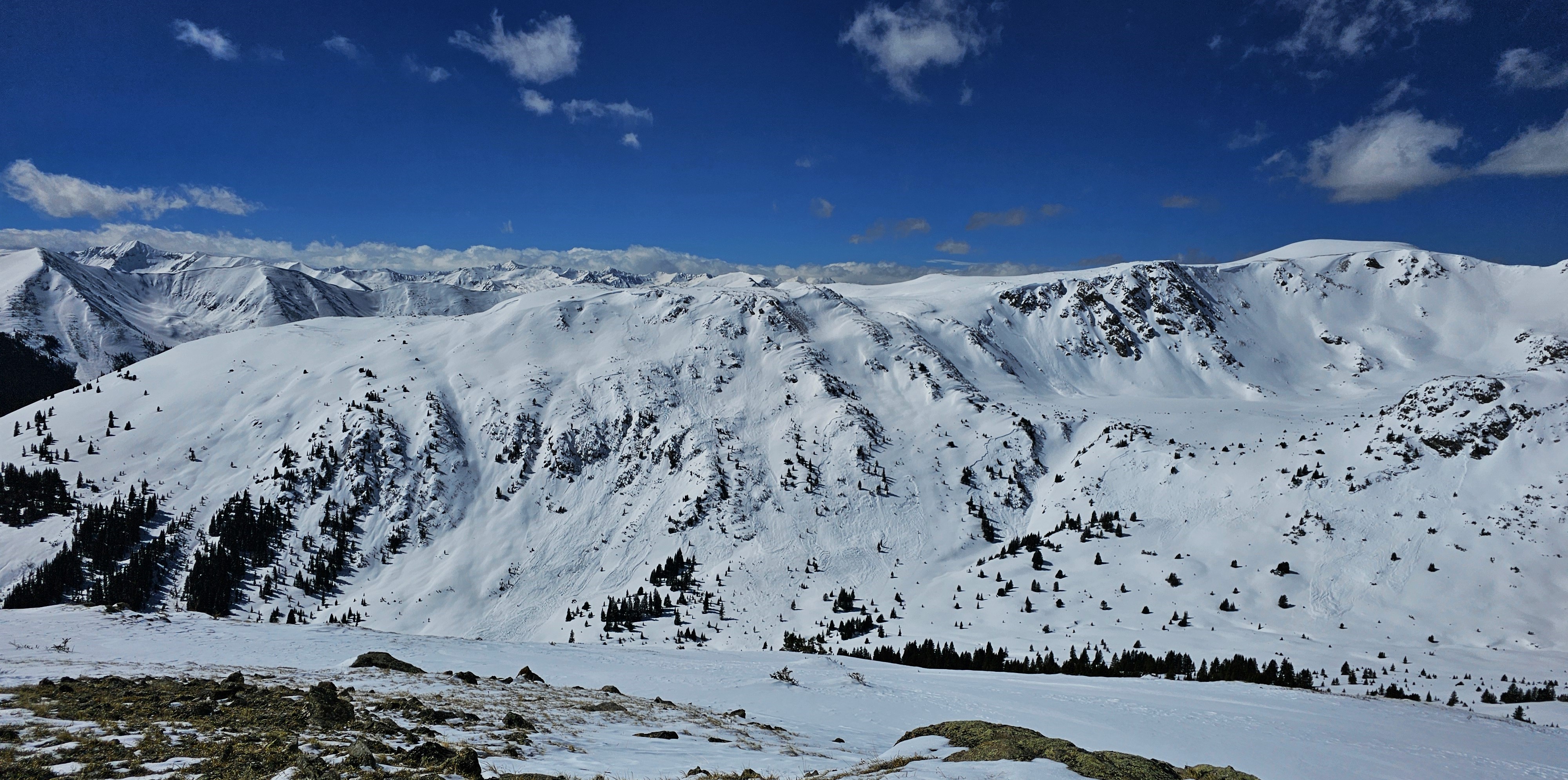 A very large and many large avalanches on wind-loaded easterly slopes at the headwaters of the Roaring Fork River. The avalanches likely occurred around February 27, 2024, during the last avalanche cycle of the month.