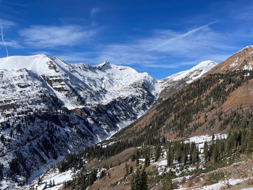 The image from November 13 looking towards Yule Pass shows the stark contrast in snow cover between southerly-facing slopes and northerly ones.