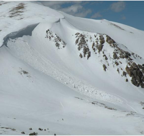 Wind Slab avalanche. Winds blew from left to right. The area above the ridge has been scoured, and the snow drifted into a wind slab on the slope below.
